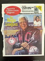 Entire 1999 Sports Collectors Digest cover with Buck O'Neil portrait and visible autograph