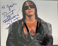 Full photograph showing Bret Hart with signature visible