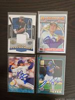 All four signed cards laid out front view