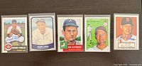 All five signed Topps Archives reprint cards side by side