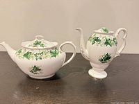 Both teapots side by side displaying shapes and pattern