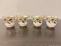 Front view of four matching Royal Chelsea teacups