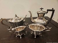 Group shot of teapot, coffee pot, sugar bowl, creamer