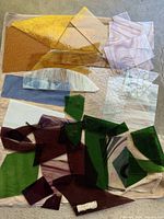 Overview of assorted stained glass pieces in multiple colours and sizes