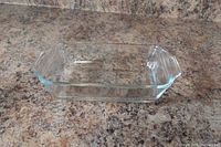 Oblique view of clear glass baking dish on countertop