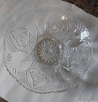 Top view of clear pressed glass bowl showing starburst pattern