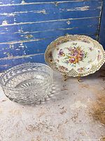 Front view of both items: crystal bowl left, porcelain bowl on stand right