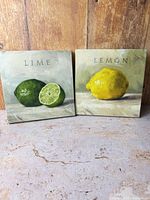 Front view of both Darren Gygi fruit canvas prints