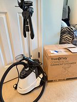 Steamer base, hose, pole with hanger, brush, and original box