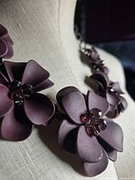 Close-up of purple silicone flower showing bead centre and petal texture