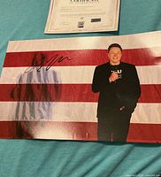 Signed 8x10 photo and partial certificate