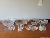 Group shot of all nine glass pieces lined on table
