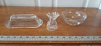 All three clear glass items aligned with ruler for scale