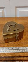 Top view showing heart shape, coin slot and latch
