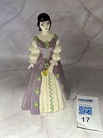 Front view of figurine showing full design and included size reference