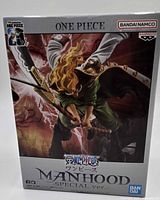 Front of sealed figure box showing artwork and branding