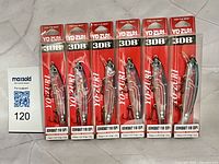 Front view of six sealed Yo-Zuri 3DB Jerkbait 110 SP lures in packaging