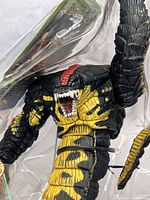 Front view of Sansker figure in molded clamshell showing paint detail and mouth