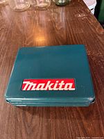 Closed Makita teal hard case top view