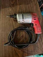Full view of Milwaukee impact wrench with cord coiled