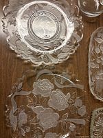 Round and square floral rose platters on tabletop