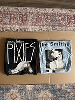Both folded shirts on surface
