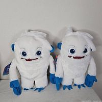 Two Hallmark Talking Charlie The Yeti plush toys standing side by side