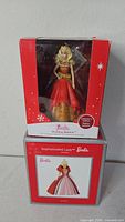 Front view of both boxed ornaments stacked