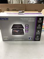 Front of Epson Perfection V550 Photo Scanner box displaying product image and branding