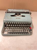 Front view of Olivetti Lettera 22 typewriter showing keyboard and body condition