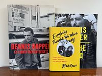 Front view showing all three books standing upright