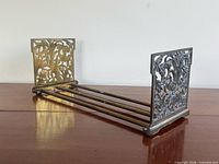 Full view showing bookends partially extended with decorative panels