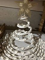 Assembled spiral tree lit with star topper