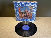 Front gatefold jacket showing lenticular cover and record with blue London mono label