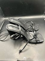 top view showing both sandals, straps, square toes, bow detail