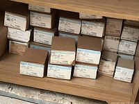 Shelved stack of boxed model 480 locksets showing labels and quantity