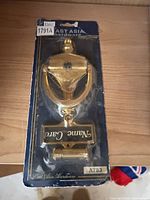 Retail-packaged East Asia Hardware polished brass door knocker model A783