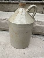 Front view of cream glazed stoneware jug