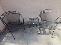 Full set showing two chairs and side table