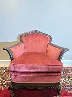 Full frontal view of burgundy velvet armchair showing overall design and condition