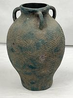 Full view of textured amphora-style pottery vase