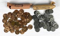 Copper Lincoln Memorial cents pile and opened wrapper