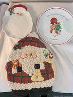All three ceramic holiday serveware items displayed together