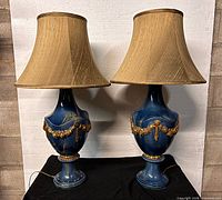Pair of blue porcelain lamps with shades front view