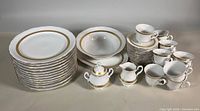Full set showing platter, serving bowl, dinner plates, sugar bowl, creamer, teacups and saucers