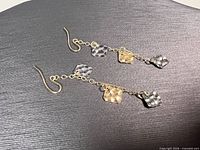 Full view of both earrings showing length, charms and ear wires