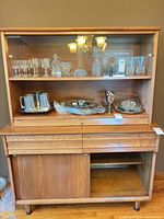 Full view of oak hutch with glass doors and lower storage