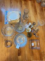All glassware pieces arranged on floor showing variety and count