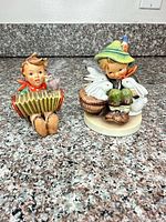 Front view of both figurines