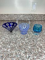 Group shot of three art glass pieces